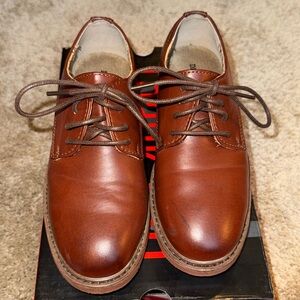 Boys' brown soft-bottom dress shoes.